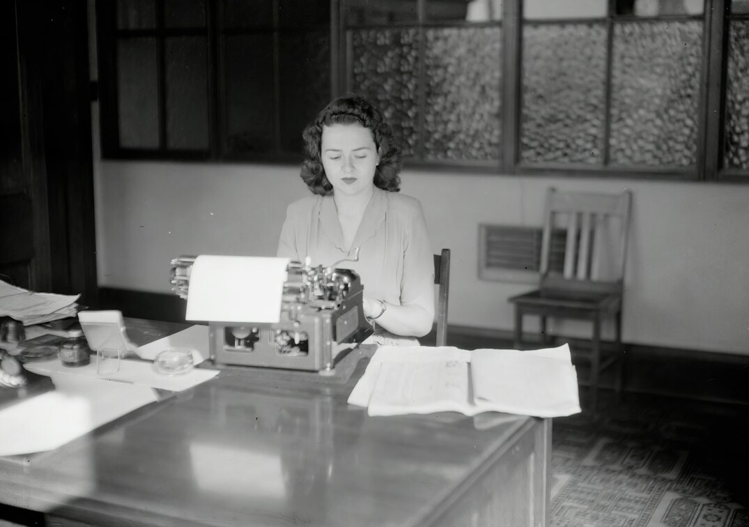 author writing at desk