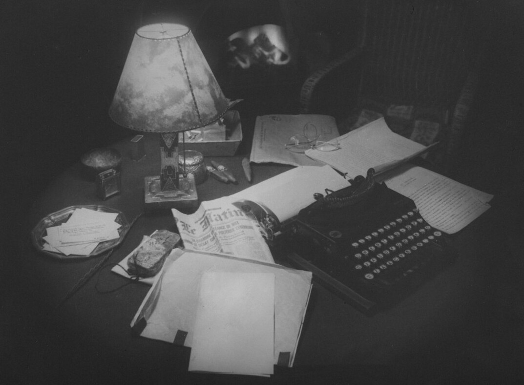 modern mystery writer at desk